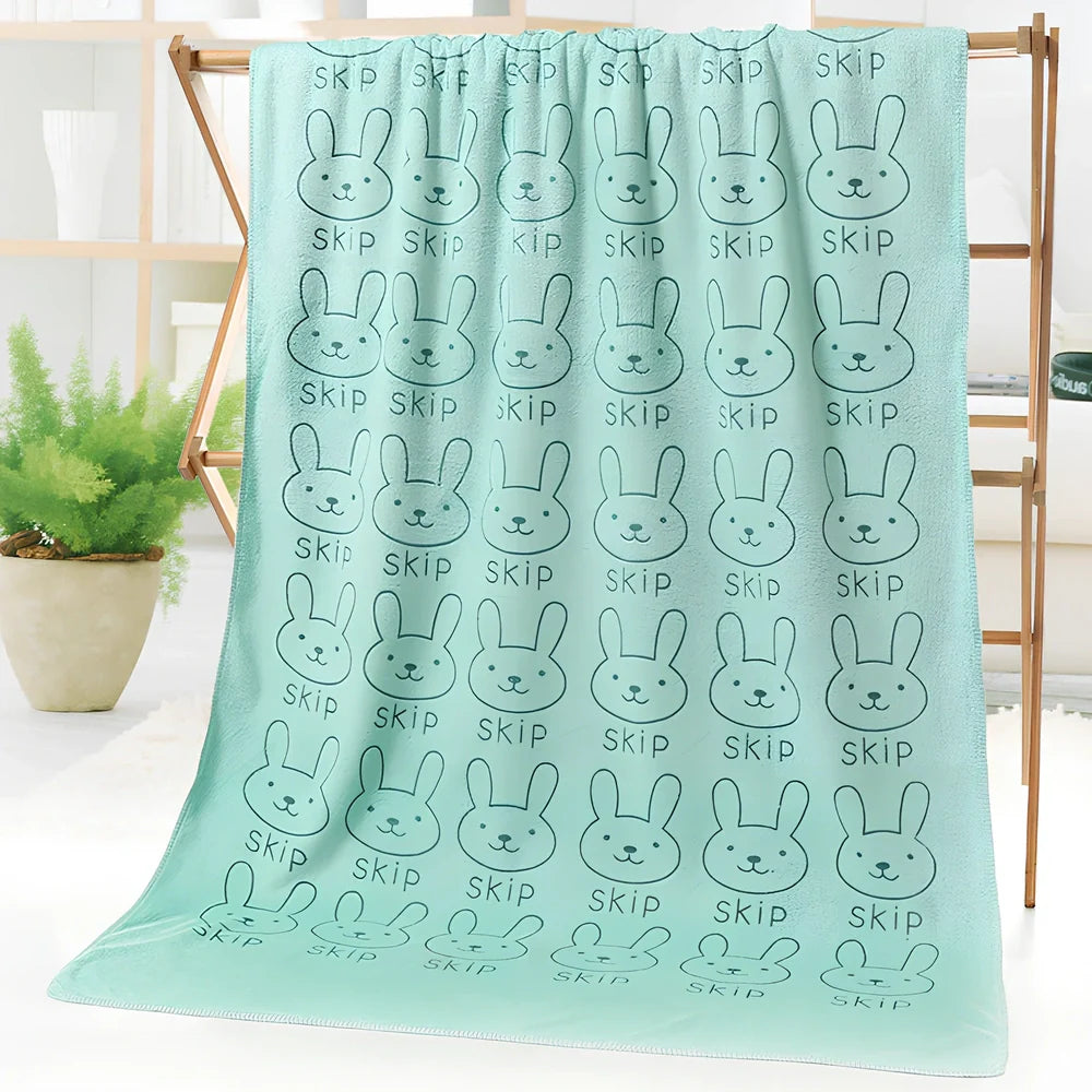 Microfiber bath towel with cartoon character print measuring 70cm wide by 140cm long