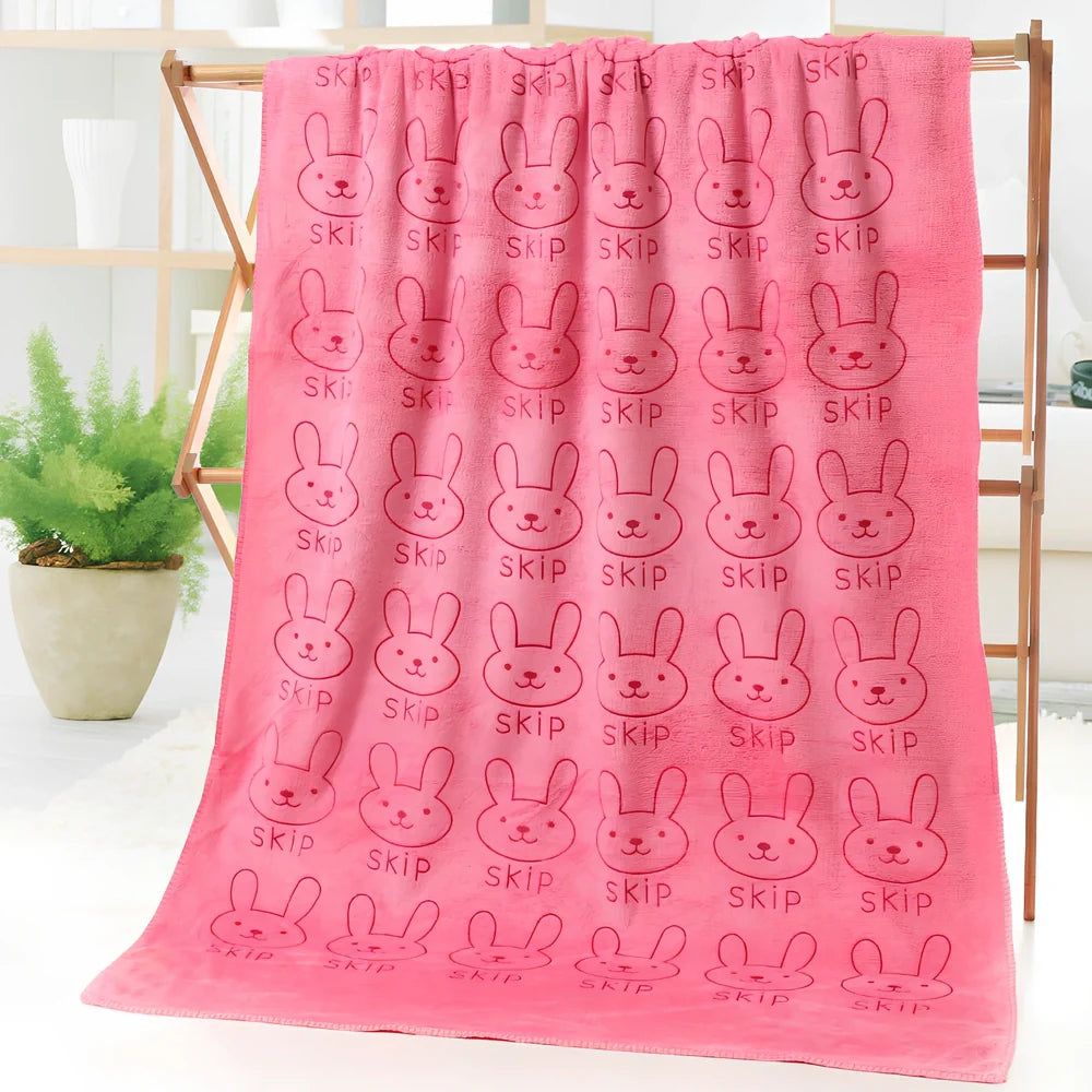Microfiber bath towel with cartoon character print measuring 70cm wide by 140cm long