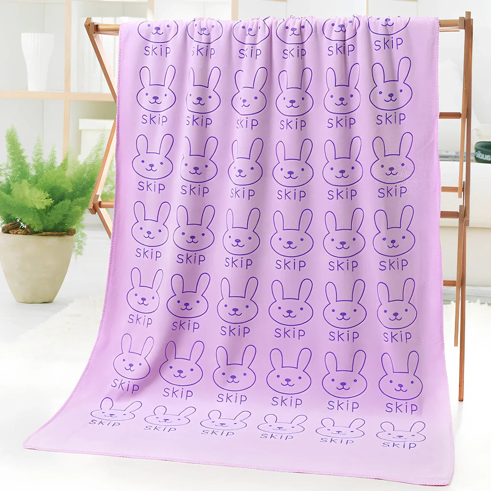 Microfiber bath towel with cartoon character print measuring 70cm wide by 140cm long
