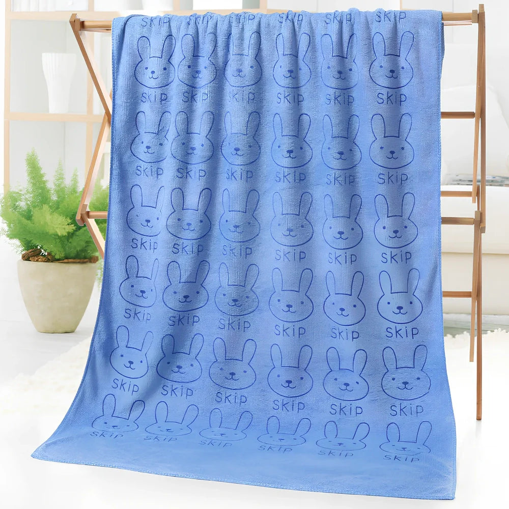 Microfiber bath towel with cartoon character print measuring 70cm wide by 140cm long