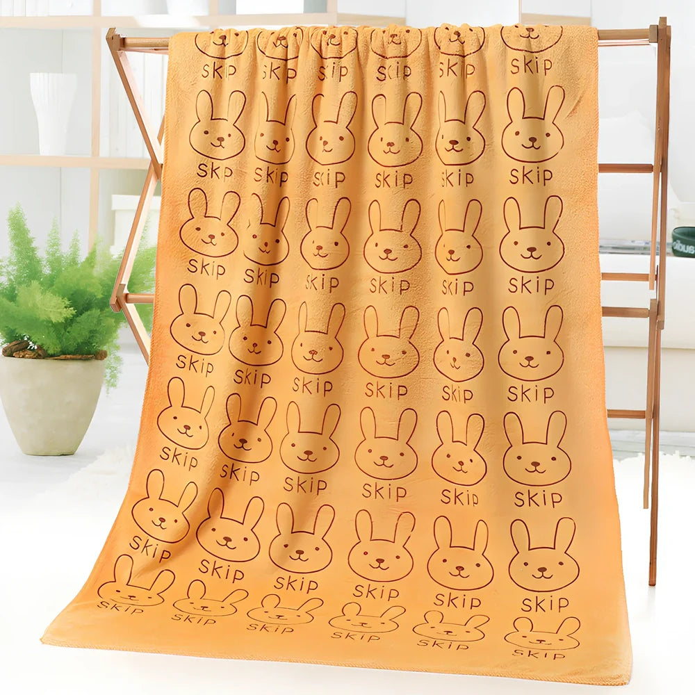 Microfiber bath towel with cartoon character print measuring 70cm wide by 140cm long