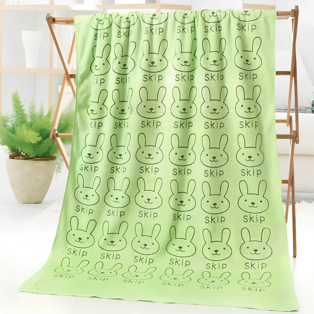 Microfiber bath towel with cartoon character print measuring 70cm wide by 140cm long