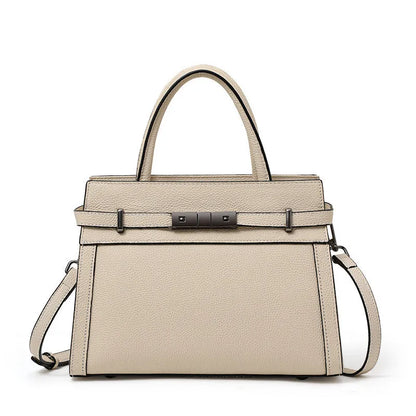 Women's square genuine leather crossbody handbag in clamshell style with internal compartments.