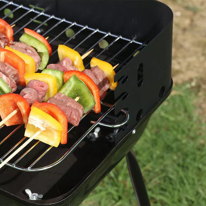 Portable outdoor barbecue oven with metal grill for camping and outdoor use