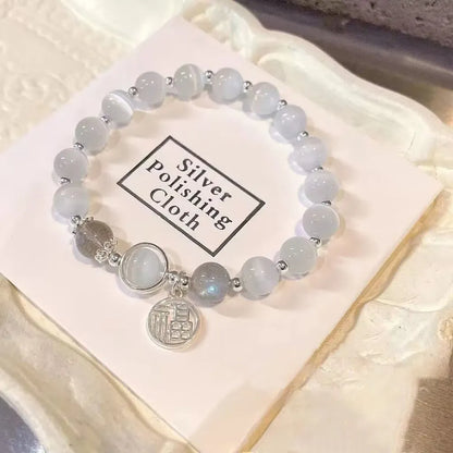 Handmade glass butterfly bracelet with drop-shaped beads in moonlight grey colour variation