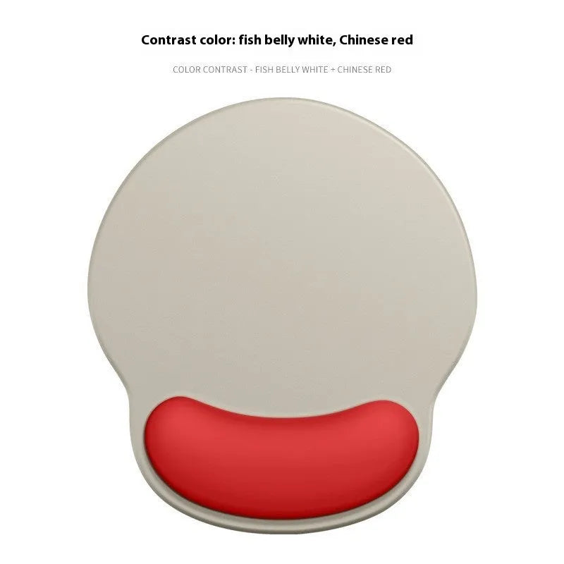 Silicone mouse mat with wristband in a gradient blue black colour pattern on a desk.