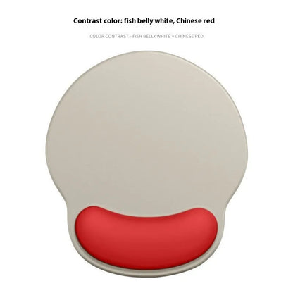 Silicone mouse mat with wristband in a gradient blue black colour pattern on a desk.