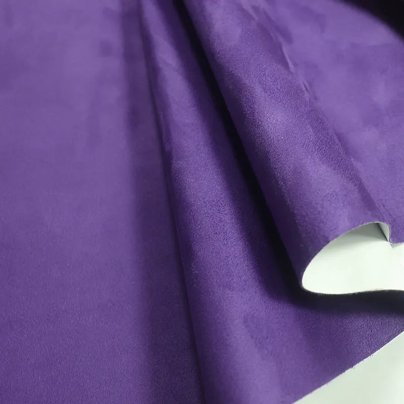 Rolls of self-adhesive leather suede in multiple colours showing texture and adhesive backing.