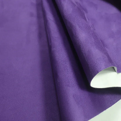 Rolls of self-adhesive leather suede in multiple colours showing texture and adhesive backing.