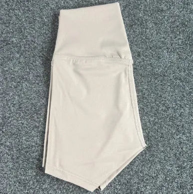 High-waisted yoga shorts in nylon fabric for moisture-wicking during sports, available in multiple colours and sizes.
