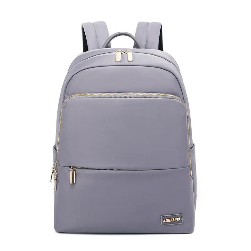 Oxford cloth women's backpack in black or purplish grey showing large capacity and padded straps