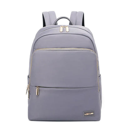 Oxford cloth women's backpack in black or purplish grey showing large capacity and padded straps
