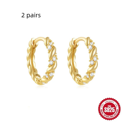 Sterling silver geometric stud earrings with small round diamond accents in gold or silver finish