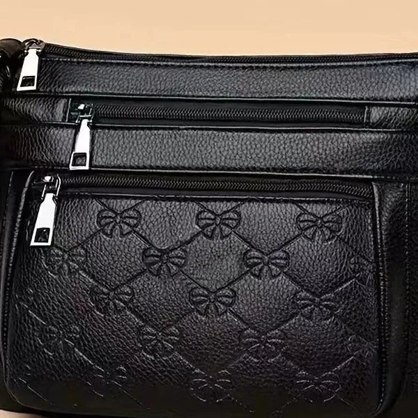 Butterfly black women's crossbody bag with horizontal square shape and embossed pattern