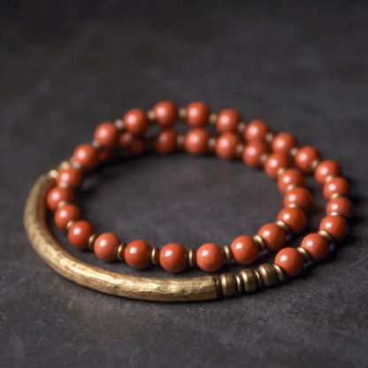 Layered retro ethnic bracelet for men and women with stone beads and brass spacers.
