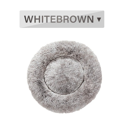 Fluffy donut-shaped dog bed in dark grey colour with raised edges, showing plush texture and circular design