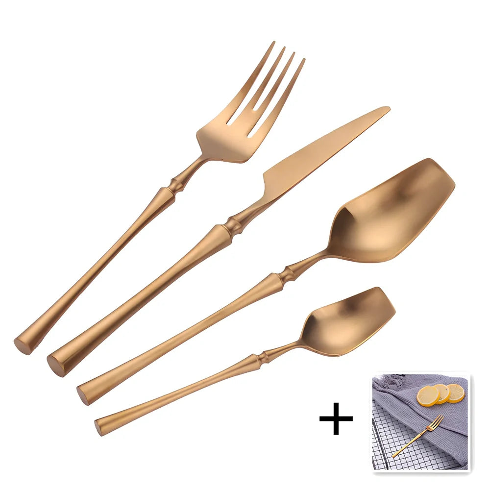 Four-piece stainless steel cutlery set showing main knife, fork, spoon, and teaspoon with mirror finish