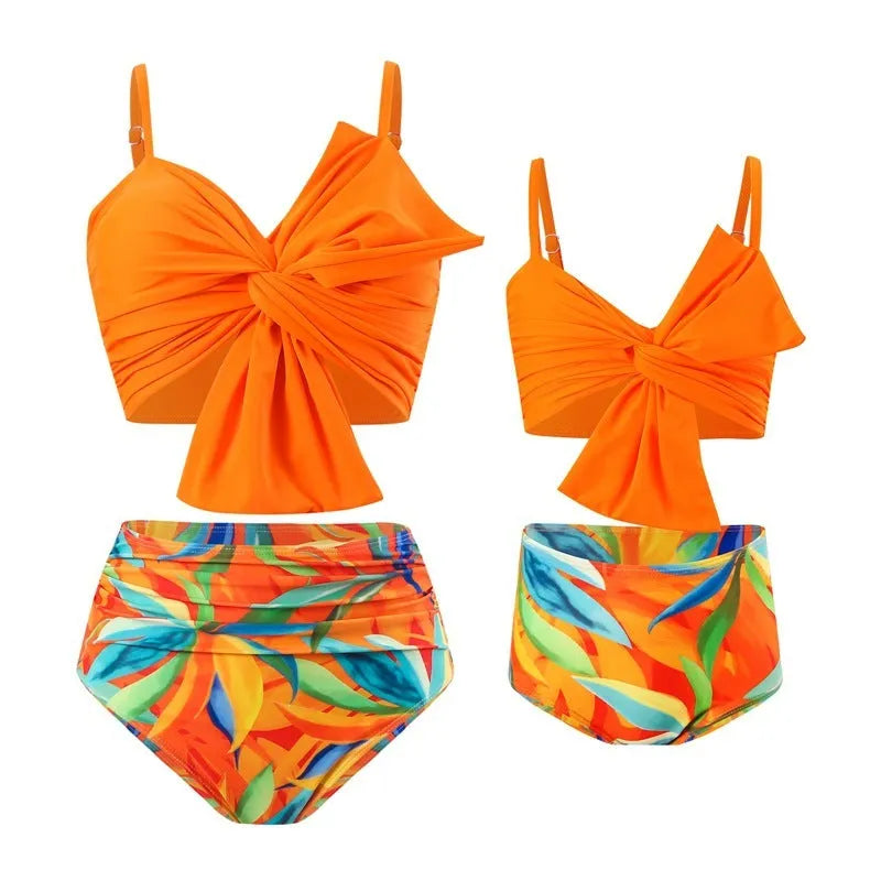 Women's big bow print bikini and swim trunks set in nylon fabric showing colour options