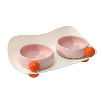 Ceramic raised pet bowl set with two bowls and non-slip base in pink, yellow and pink-yellow colours
