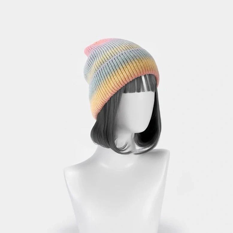 Gradient yarn knitted hat with tapered top in light blue colour showing knitted texture