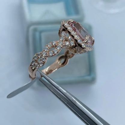 Rose gold electroplated geometric alloy ring on a white background.