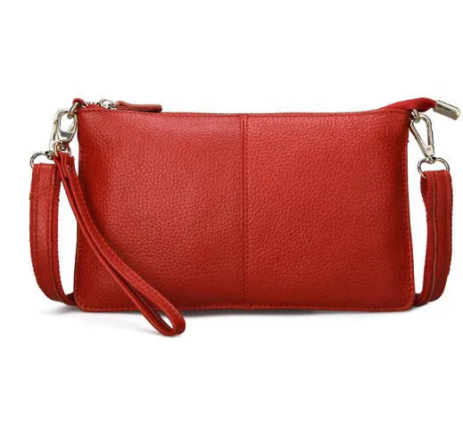 Lady's cowhide slant bag in apricot colour showing front view with strap and compact 24 cm size.