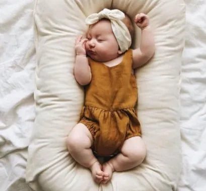 Beige portable cotton baby nest crib measuring 75 by 45 centimetres for newborn infants