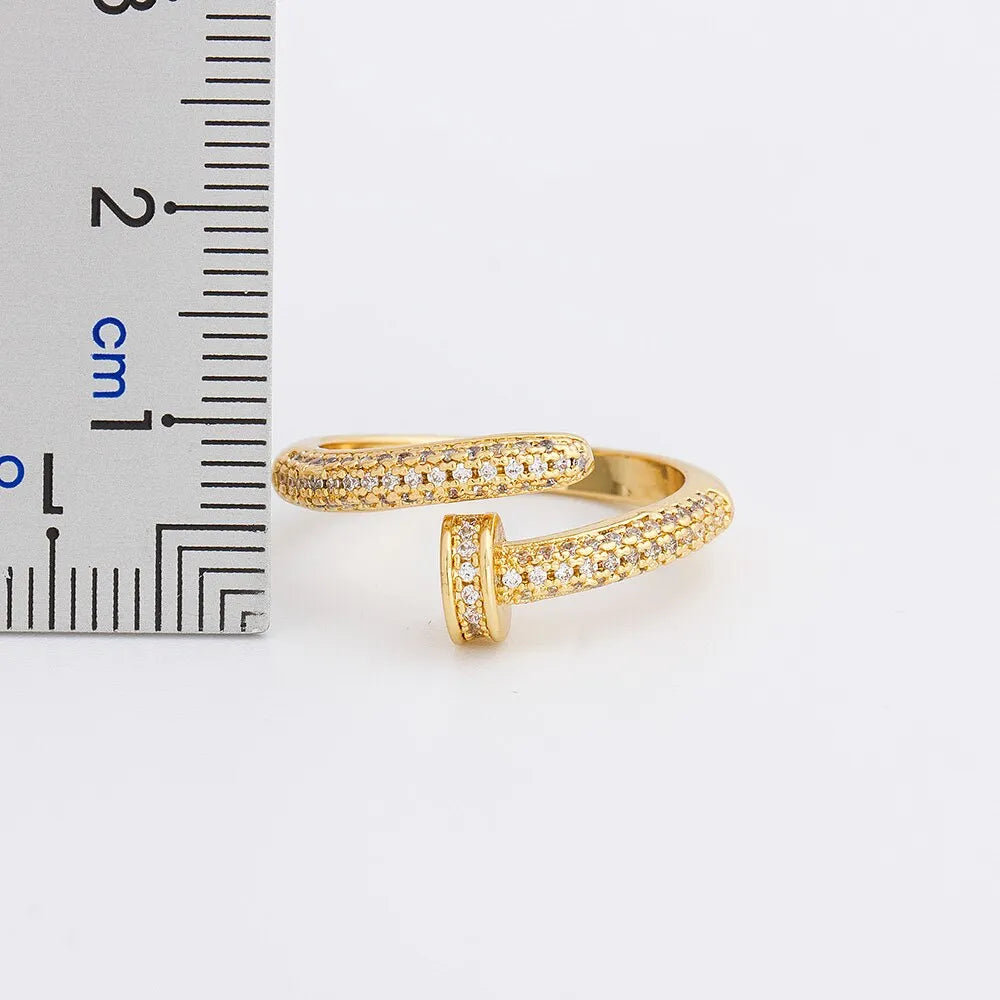 Personalized nail ring in gold with geometric metal design and inlaid drill detail, adjustable opening