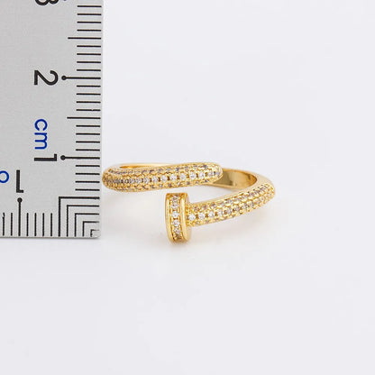 Personalized nail ring in gold with geometric metal design and inlaid drill detail, adjustable opening