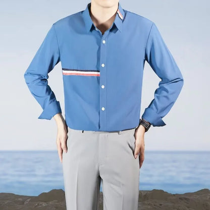 Hong Kong style loose cotton blend cardigan shirt in light blue on a hanger
