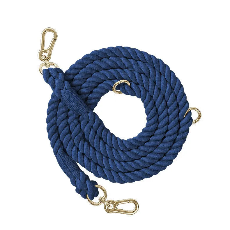 Woven rainbow pattern dog leash with double grip handles and a metal clasp.