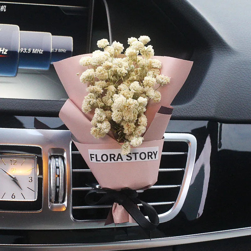 Mini dried flower bouquet mounted in car air vent for decorative aromatherapy
