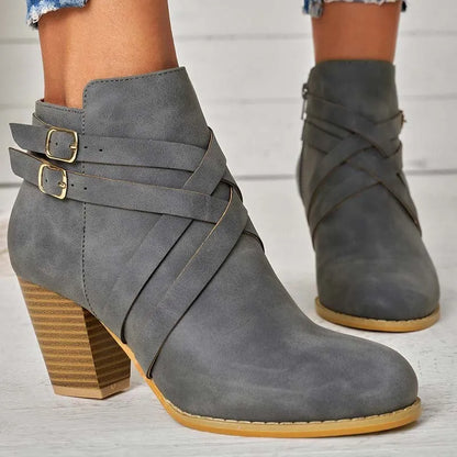 Women's plus size black PU leather short ankle boots with a 7cm heel and side zipper.