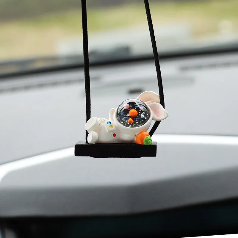 Colourful resin astronaut car pendant ornament with cartoon spaceman design on car dashboard