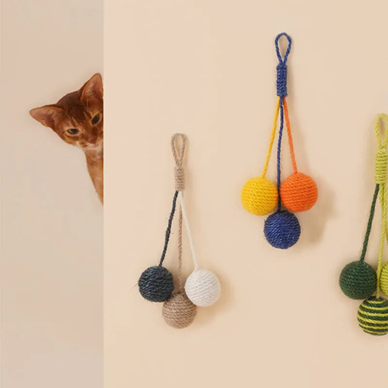 Cat toy set showing a colourful teaser stick and a bite-resistant catnip ball on a white background.