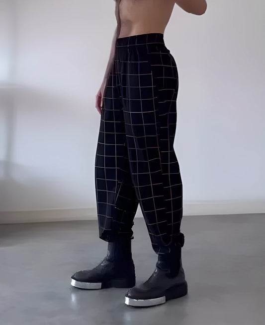 Men's plaid trousers with an apron-style front panel and elastic waistband