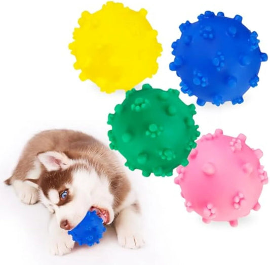 Four colourful spiky dog balls with paw print dimples, measuring 2 inches diameter for small breed dogs