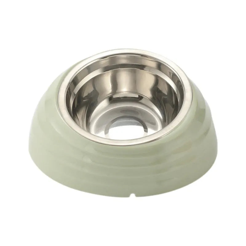 Single stainless steel cat bowl with a light green plastic base on a floor.