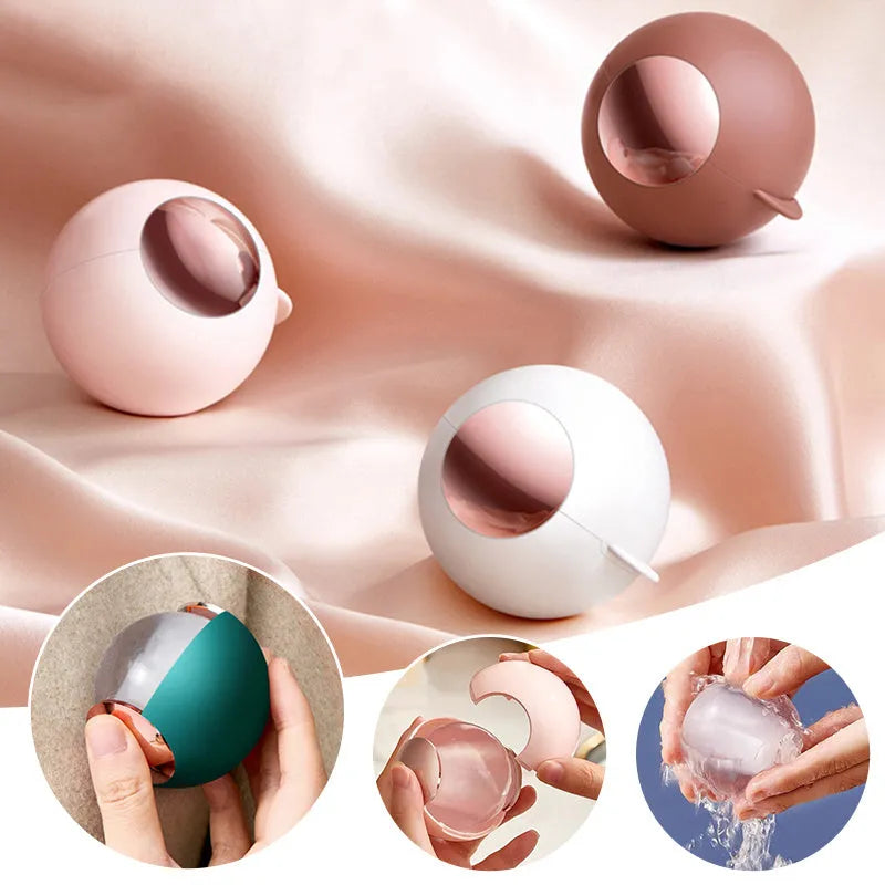 White, pink, green, and deep pink coloured ABS hair removal ball with a handle for pet hair and lint.