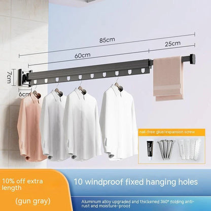 Aluminum retractable drying rack mounted on a window, extending outward for clothes drying