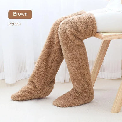 Cozy over-the-knee fuzzy socks in various colors, including brown, blue, dark gray, pink, silver, and more. Comfortable cotton design for warm, snug legs.