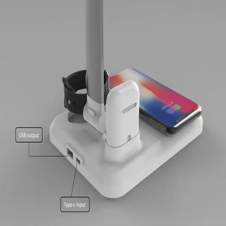 Black and white 4-in-1 LED desk lamp with wireless charging pad and Bluetooth speaker