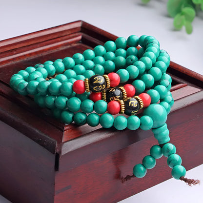 Turquoise Tibetan 108 beads bracelet with synthetic stone powder construction