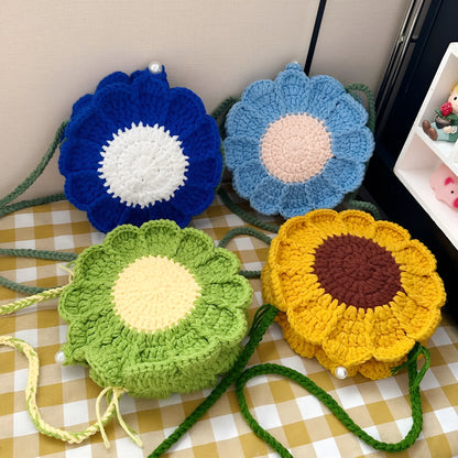 Hand-woven round bag with wool crochet flowers and cotton lining