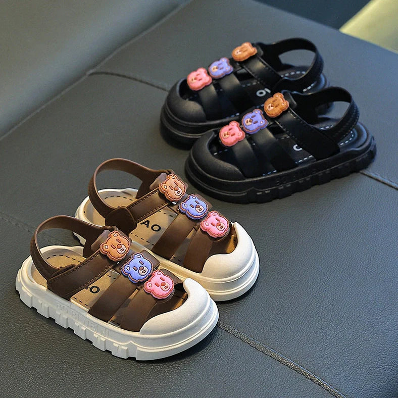 Boy's cartoon pattern baby shoes with non-slip PVC soles and Velcro fastening in black colour