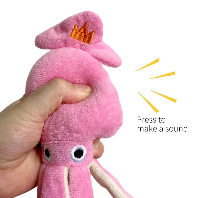 Pink squid-shaped corduroy plush dog toy with rope-like tentacles