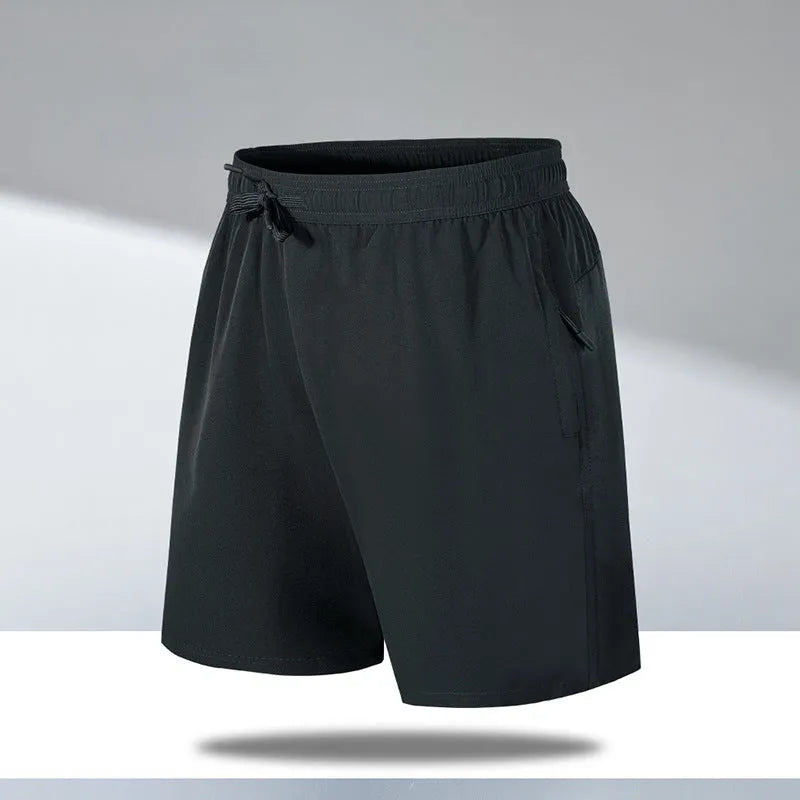 Man wearing black loose-fit ice silk sports shorts with a micro-elastic waistband, suitable for running or casual summer wear.