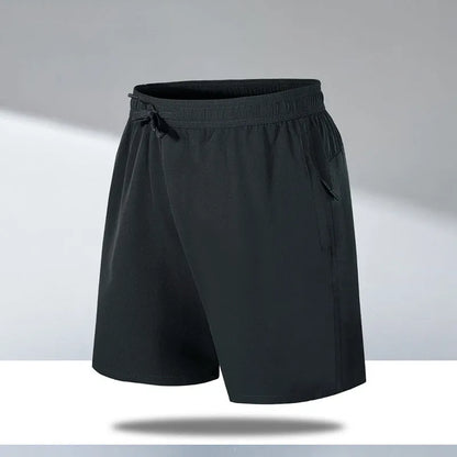Man wearing black loose-fit ice silk sports shorts with a micro-elastic waistband, suitable for running or casual summer wear.