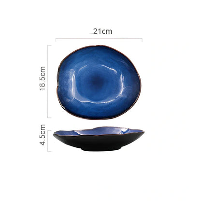 Blue irregular ceramic plate with kiln-changing glaze pattern, measuring approximately 20cm across irregular edges