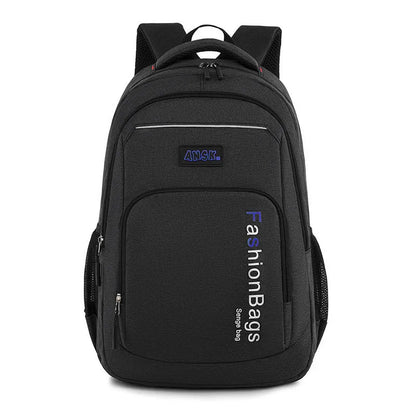 Black nylon street-style backpack with double shoulder straps, shown with open compartment revealing internal laptop sleeve and pockets.